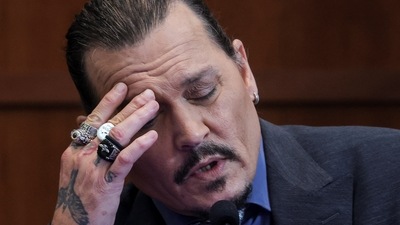 Johnny Depp reacts as he testifies in the courtroom during his defamation trial against his ex-wife Amber Heard, at the Fairfax County Circuit Courthouse in Fairfax, Virginia, U.S., May 25, 2022. REUTERS/Evelyn Hockstein/Pool (REUTERS)