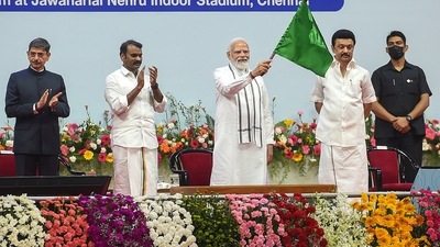 PM Modi flags off a train to inaugurate the newly converted broad gauge line between Madurai and Teni stations during the foundation stone laying and dedication to the nation of multi-crore infrastructure projects, at Jawaharlal Nehru Stadium in Chennai. (PTI) PM Modi flags off a train to inaugurate the newly converted broad gauge line between Madurai and Teni stations during the foundation stone laying and dedication to the nation of multi-crore infrastructure projects, at Jawaharlal Nehru Stadium in Chennai. (PTI)
