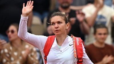 Romania's Simona Halep acknowledges the spectators after losing her second round match against China's Qinwen Zheng&nbsp; (REUTERS)