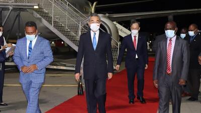 Solomon Island's Foreign Minister Jeremiah Manele (left) and Chief Protocole Walter Diamana (right) escorting Chinese Foreign Minister Wang Yi (centre) upon his arrival at the Henderson International Airport in Honiara. (AFP) Solomon Island's Foreign Minister Jeremiah Manele (left) and Chief Protocole Walter Diamana (right) escorting Chinese Foreign Minister Wang Yi (centre) upon his arrival at the Henderson International Airport in Honiara. (AFP)