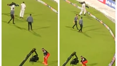 Virat Kohli sits in disbelief as Kolkata policeman carries fan on shoulders Virat Kohli sits in disbelief as Kolkata policeman carries fan on shoulders