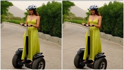 Kriti tried out riding on the streets of Udaipur. In a neon gown, the actor looked vacay-ready. (Instagram/@kriti.kharbanda)