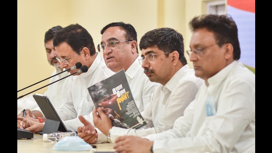 Senior Congress leaders Ajay Maken and Randeep Singh Sujrewala address a press conference after releasing a booklet, at AICC headquarters in New Delhi on Thursday, May 26, 2022. (PTI)