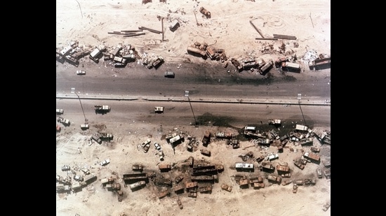 Aerial view of destroyed Iraqi vehicles beside Highway 80 west of Kuwait City. The ‘Highway of Death ‘ was bombed by coalition forces led by the United States on February 27-28, 1991. (Shutterstock)