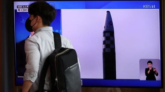 A man walks past a TV broadcasting a news report on North Korea's launch of three missiles, in Seoul.&nbsp;(REUTERS)