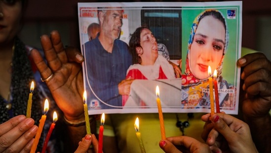 Students of a dance institute light candles to pay tribute to TV artiste Amreen Bhat, in Jammu, Thursday,&nbsp;(PTI)