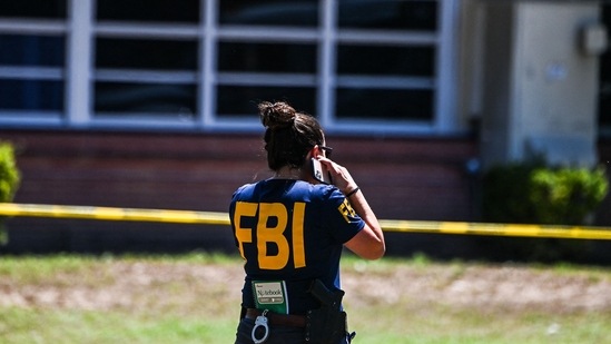 An FBI agent is seen outside Robb Elementary School in Uvalde, Texas, on May 25, 2022.(AFP) An FBI agent is seen outside Robb Elementary School in Uvalde, Texas, on May 25, 2022.(AFP)