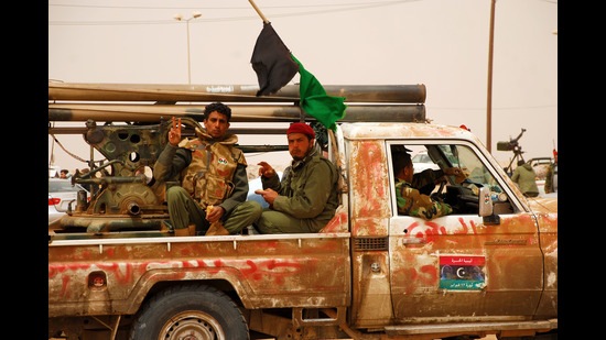 Libyan rebels travel to a battle line to fight Colonel Muammar Gaddafi’s army on April 7, 2011. (Shutterstock)