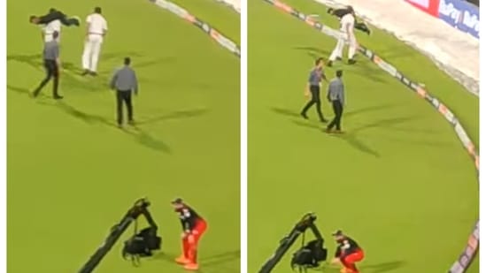 Virat Kohli sits in disbelief as Kolkata policeman carries fan on shoulders Virat Kohli sits in disbelief as Kolkata policeman carries fan on shoulders