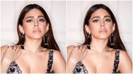 The lehenga featured a sleeveless `blouse embroidered in black resham threads and a long flowy black skirt detailed in silver and white floral patterns.(Instagram/@alayaf)