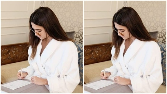 In the hotel, Kriti looked at some papers, looking as usual stunning in her white attire and tinted shades.(Instagram/@kriti.kharbanda)