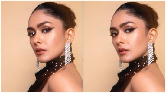 Styled by fashion stylist Sheefa J Gilani, Mrunal wore her tresses into a clean bun as she posed for the cameras.(Instagram/@mrunalthakur)