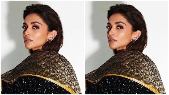 Deepika's bodycon gown came intricately detailed in black and gold threads. The gown- featured dramatic shoulder capes with black fringes cascading to full sleeves. In gold and silver ear studs, she minimally accessorised her look.(Instagram/@deepikapadukone)