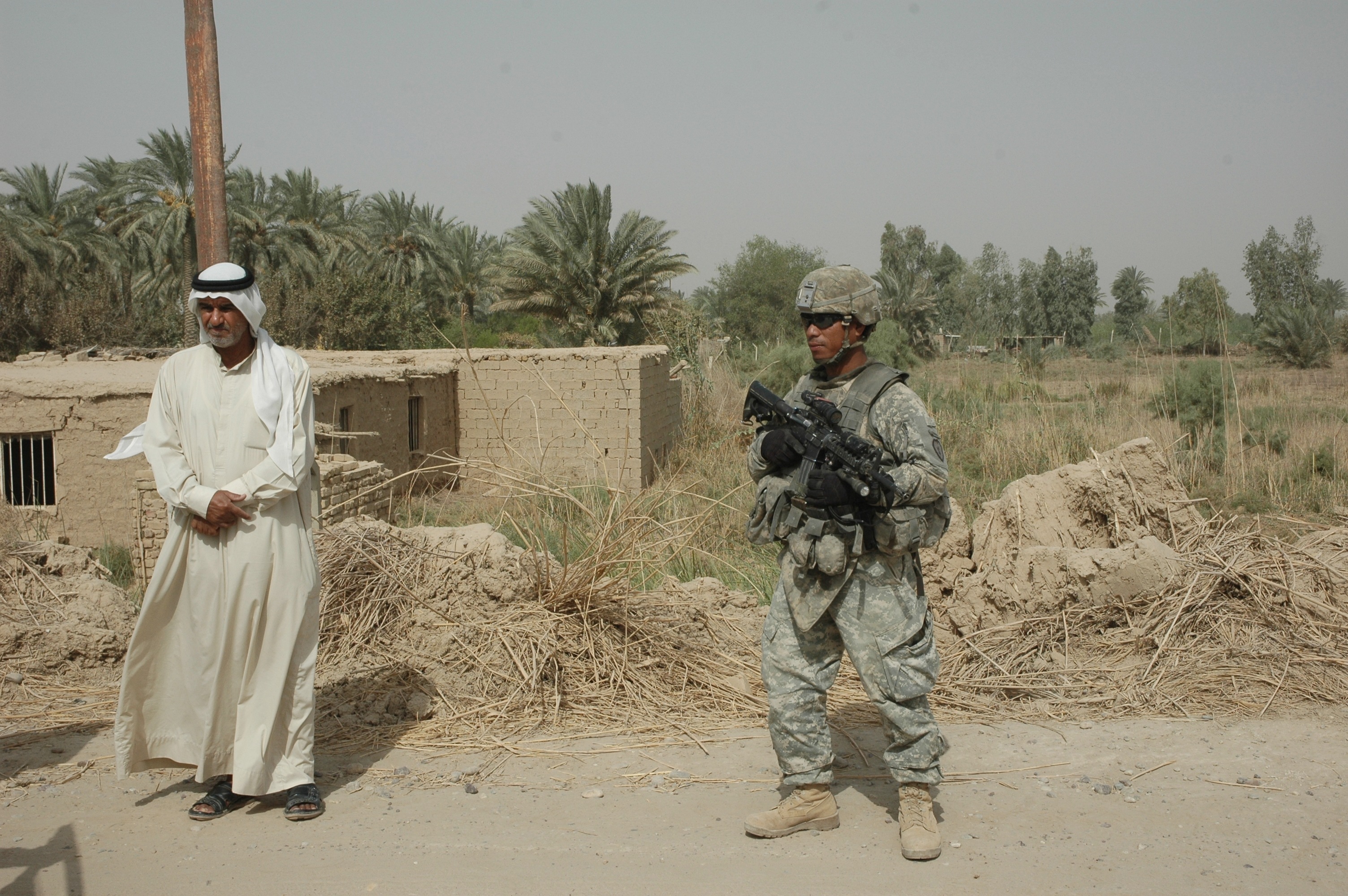 US soldiers conducting a patrol and setting up a checkpoint at Taji in Iraq on 13 August, 2008. (Shutterstock)