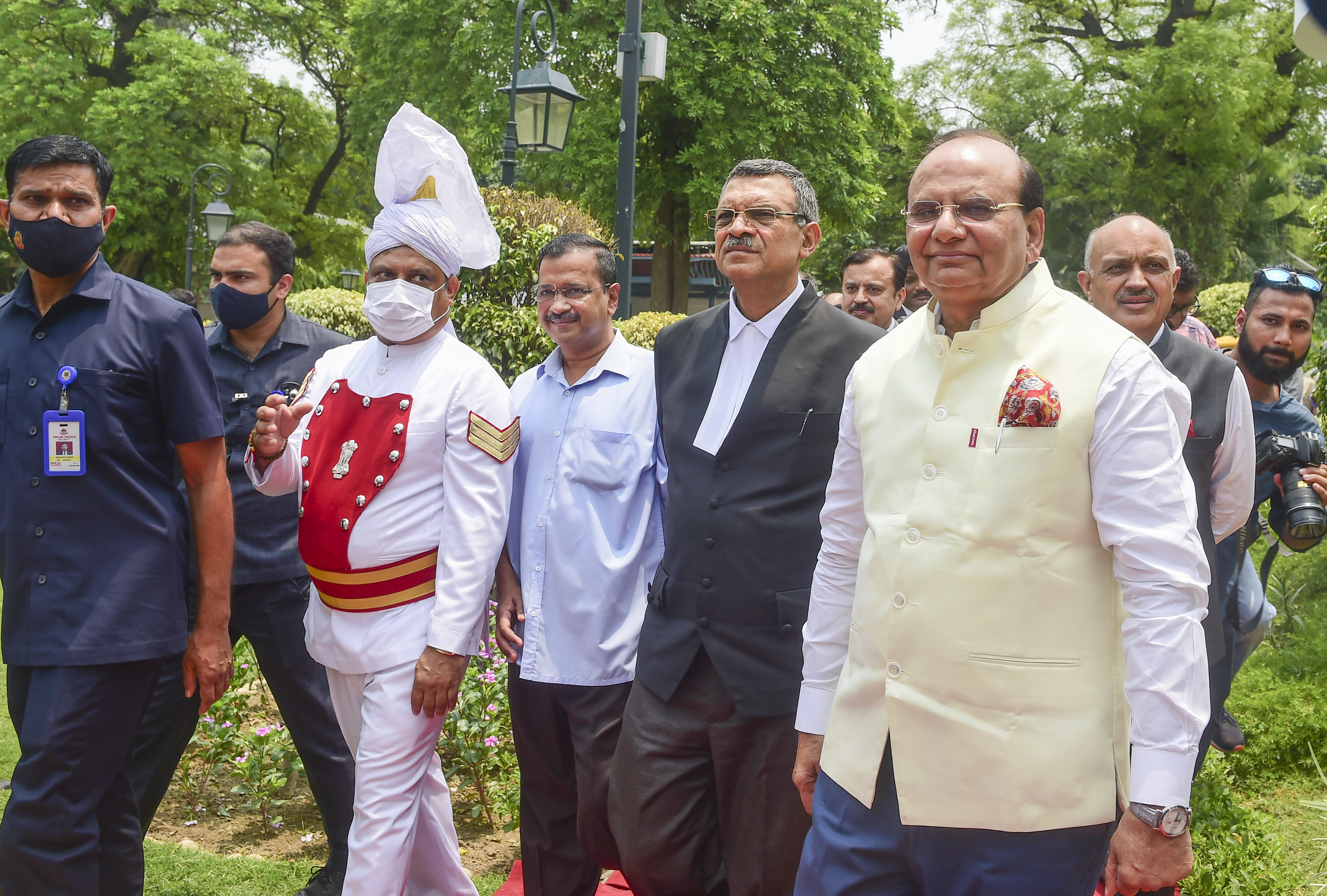 Lt Governor of Delhi Vinai Kumar Saxena with chief justice of Delhi high court Vipin Sanghi and Delhi CM Arvind Kejriwal at the Raj Niwas on Thursday. (PTI) Lt Governor of Delhi Vinai Kumar Saxena with chief justice of Delhi high court Vipin Sanghi and Delhi CM Arvind Kejriwal at the Raj Niwas on Thursday. (PTI)