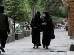 Afghan women walk on a street in Kabul, Afghanistan.