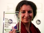 Author Geetanjali Shree poses with the 2022 International Booker Prize award for her novel 'Tomb of Sand' in London, Thursday.