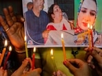 Jammu: Students of a dance institute light candles to pay tribute to TV artist Amreen Bhat, in Jammu, Thursday, May 26, 2022. Jammu: Students of a dance institute light candles to pay tribute to TV artist Amreen Bhat, in Jammu, Thursday, May 26, 2022. 