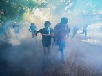 Police use tear gas to disperse university students protesting to demand the resignation of Sri Lanka's President Gotabaya Rajapaksa over the country's crippling economic crisis, in Colombo.