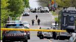 Police officers work at the scene where police shot and injured a suspect who was walking down a city street carrying a gun, as four nearby schools were placed on lockdown, in Toronto, Ontario, Canada. (REUTERS) Police officers work at the scene where police shot and injured a suspect who was walking down a city street carrying a gun, as four nearby schools were placed on lockdown, in Toronto, Ontario, Canada. (REUTERS)