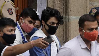 Bollywood megastar Shah Rukh Khan's son Aryan Khan (center) was on Friday, May 27, cleared by authorities in a drugs-on-cruise case with no possession and corroborative evidence suggesting his involvement in a drug network, the investigating agency said. (AP Photo/Rajanish Kakade, File) Bollywood megastar Shah Rukh Khan's son Aryan Khan (center) was on Friday, May 27, cleared by authorities in a drugs-on-cruise case with no possession and corroborative evidence suggesting his involvement in a drug network, the investigating agency said. (AP Photo/Rajanish Kakade, File)