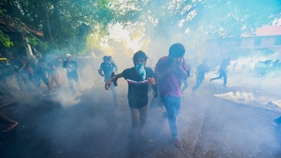 Police use tear gas to disperse university students protesting to demand the resignation of Sri Lanka's President Gotabaya Rajapaksa over the country's crippling economic crisis, in Colombo. (AFP) Police use tear gas to disperse university students protesting to demand the resignation of Sri Lanka's President Gotabaya Rajapaksa over the country's crippling economic crisis, in Colombo. (AFP)