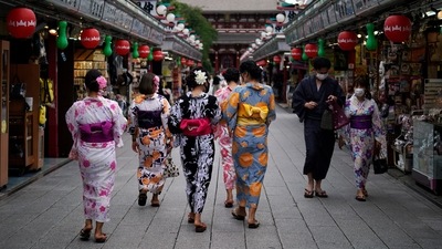 Tourists in traditional Japanese kimonos walk in Asakusa district in Tokyo, 2020. (AP) Tourists in traditional Japanese kimonos walk in Asakusa district in Tokyo, 2020. (AP)