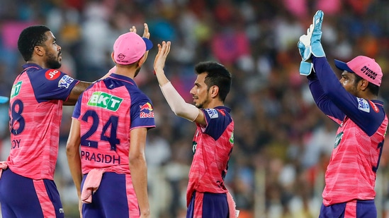 Obed Mccoy of Rajasthan Royals celebrates with teammates after taking a wicket during the Indian Premier League 2022 Qualifier 2(PTI)