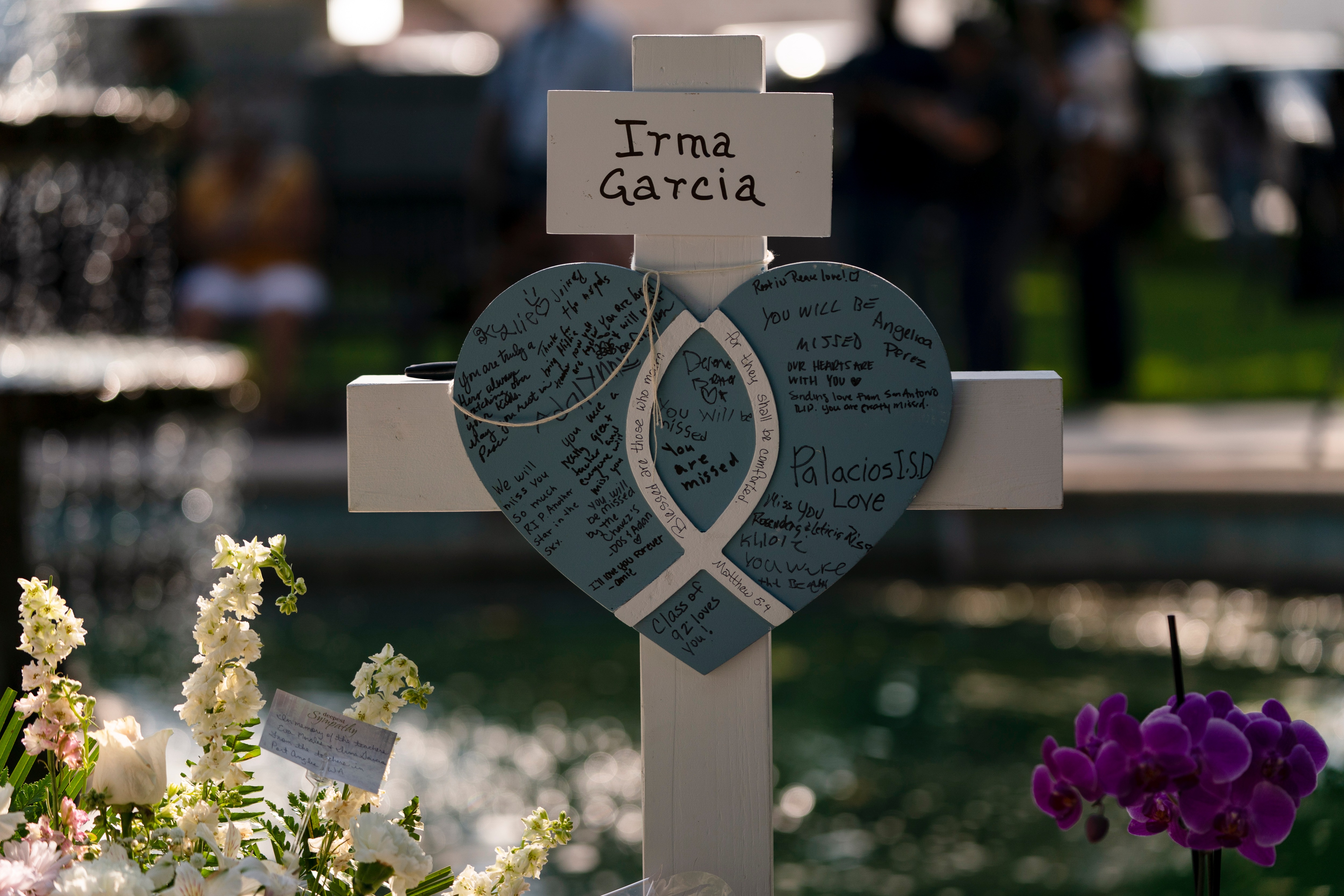 Messages are written on a cross honoring Irma Garcia, a teacher who was killed in this week's elementary school shooting, in Uvalde, Texas, on May 26, 2022.&nbsp; (AP)
