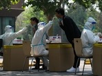 Residents get swabbed for mass Covid test in Beijing.