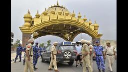 Rapid Action Force and Punjab Police personnel checking vehicles at the Golden Gate ahead of the anniversary of Operation Bluestar in Amritsar on Saturday.  (Sameer Sehgal/HT)