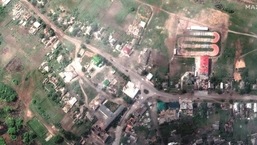 A satellite image shows damaged buildings and a tank on a road, in Lyman, Ukraine May 25, 2022.