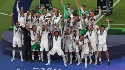 Real Madrid players celebrate with the trophy after winning the Champions League final (AP) Real Madrid players celebrate with the trophy after winning the Champions League final (AP)