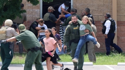 Children run to safety during a mass shooting at an elementary school where a gunman killed 19 children and two adults in Uvalde, Texas. (via Reuters)