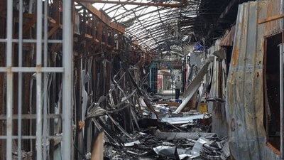 A local resident stands next to debris of an open market destroyed by a military strike, as Russia's attack on Ukraine continues, in Sievierodonetsk, Luhansk region. (File image) (REUTERS)