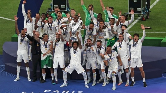 Real Madrid players celebrate with the trophy after winning the Champions League final(AP)