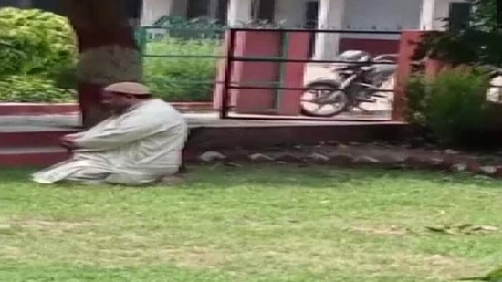 Screengrab from viral video of namaz being offered by a professor on campus of Shri Varshney College in Aligarh, Uttar Pradesh. (ANI)