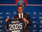 PSG striker Kylian Mbappe shows his jersey during a press conference Monday, May 23, 2022 at the Paris des Princes stadium in Paris. PSG striker Kylian Mbappe shows his jersey during a press conference Monday, May 23, 2022 at the Paris des Princes stadium in Paris.