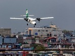 Tara Air's DHC-6 Twin Otter, tail number 9N-AET prepares to land at the airport of Pokhara, Nepal. Picture taken April 11, 2022. (REUTERS/Nicolas Economou)