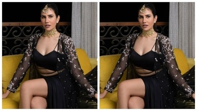 Sonnalli teamed a black corset bra with a black satin skirt with a thigh high slit. She added more oomph to her look with a dramatic satin cape intricately decorated in white threads. (Instagram/@sonnalliseygall)