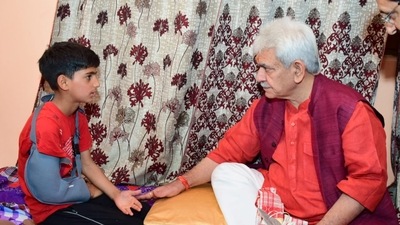 Jammu and Kashmir lieutenant governor Manoj Sinha interacts with the family members of slain TV artiste Amreen Bhat in Budgam. (Twitter/@officeofLGJ&K) Jammu and Kashmir lieutenant governor Manoj Sinha interacts with the family members of slain TV artiste Amreen Bhat in Budgam. (Twitter/@officeofLGJ&K)