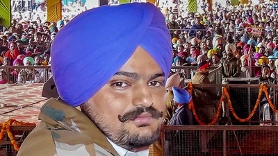 In this file photo dated Dec. 10, 2021 file photo, Congress leader and famous Punjabi singer Sidhu Moosewala, who was shot dead after unidentified persons opened fire at him in Punjab's Mansa district on Sunday, May 29, 2022. The incident took place a day after the Punjab government withdrew his security cover. (PTI Photo) In this file photo dated Dec. 10, 2021 file photo, Congress leader and famous Punjabi singer Sidhu Moosewala, who was shot dead after unidentified persons opened fire at him in Punjab's Mansa district on Sunday, May 29, 2022. The incident took place a day after the Punjab government withdrew his security cover. (PTI Photo)