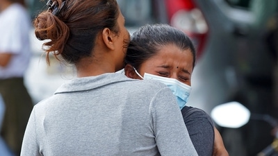 Family members and relatives of passengers onboard the Twin Otter aircraft operated by Tara Air outside the airport in Pokhara on Sunday. (AFP) Family members and relatives of passengers onboard the Twin Otter aircraft operated by Tara Air outside the airport in Pokhara on Sunday. (AFP)