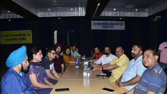 IMA members and MC officials during a meeting at IMA house in BRS Nagar, Ludhiana. (HT PHOTO)