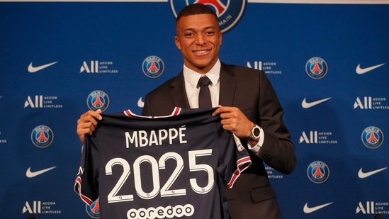 PSG striker Kylian Mbappe shows his jersey during a press conference Monday, May 23, 2022 at the Paris des Princes stadium in Paris.(AP)