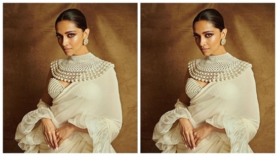 Deepika teamed a corset style white off-shoulder blouse with folded details with a white ruffle saree and gave us major goals.(Instagram/@deepikapadukone)