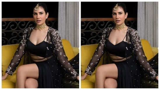 Sonnalli teamed a black corset bra with a black satin skirt with a thigh high slit. She added more oomph to her look with a dramatic satin cape intricately decorated in white threads.(Instagram/@sonnalliseygall)