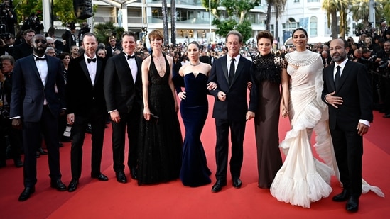 French actor and President of the Jury of the 75th Cannes Film Festival Vincent Lindon with French director Ladj Ly, Norwegian film director Joachim Trier, US film director Jeff Nichols, British actress Rebecca Hall, Swedish actress Noomi Rapace, Italian actress Jasmine Trinca, Indian actress Deepika Padukone and Iranian film director Asghar Farhadi.&nbsp;(AFP)