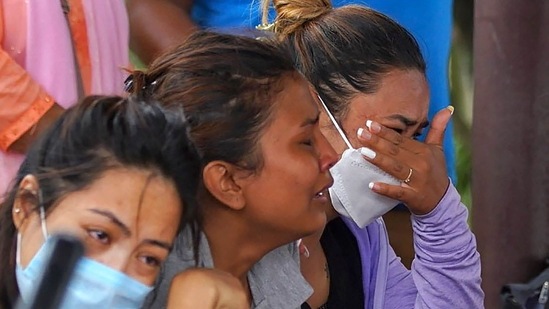 Family members and relatives of passengers on board the Twin Otter aircraft, weep outside the airport in Pokhara. According to th official statement by the airline, the plane was carrying four Indians, two Germans and 16 Nepalis, including three crew.(AFP)