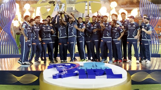 Gujarat Titans players with the IPL trophy after winning the final T20 cricket match of the Indian Premier League 2022(PTI)